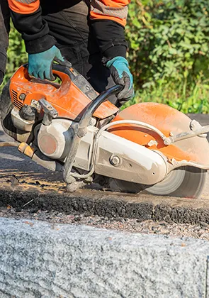 A professional worker working on a wood cutter